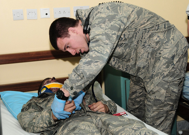 Firefighters from the 386th Expeditionary Civil Engineer Squadron remove a simulated victim